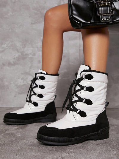 Black and White Faux Leather Lace-Up Lug Sole Boots: Stylish and Sturdy Footwear for Any Occasion