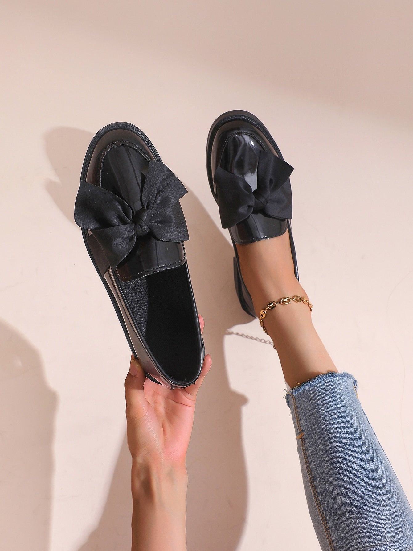 Elevate your style and comfort with these chic and comfortable women's black loafers. The elegant bow detail adds a touch of sophistication while the comfortable design ensures all-day support. Perfect for any occasion, these loafers are a must-have for any fashion-forward woman.