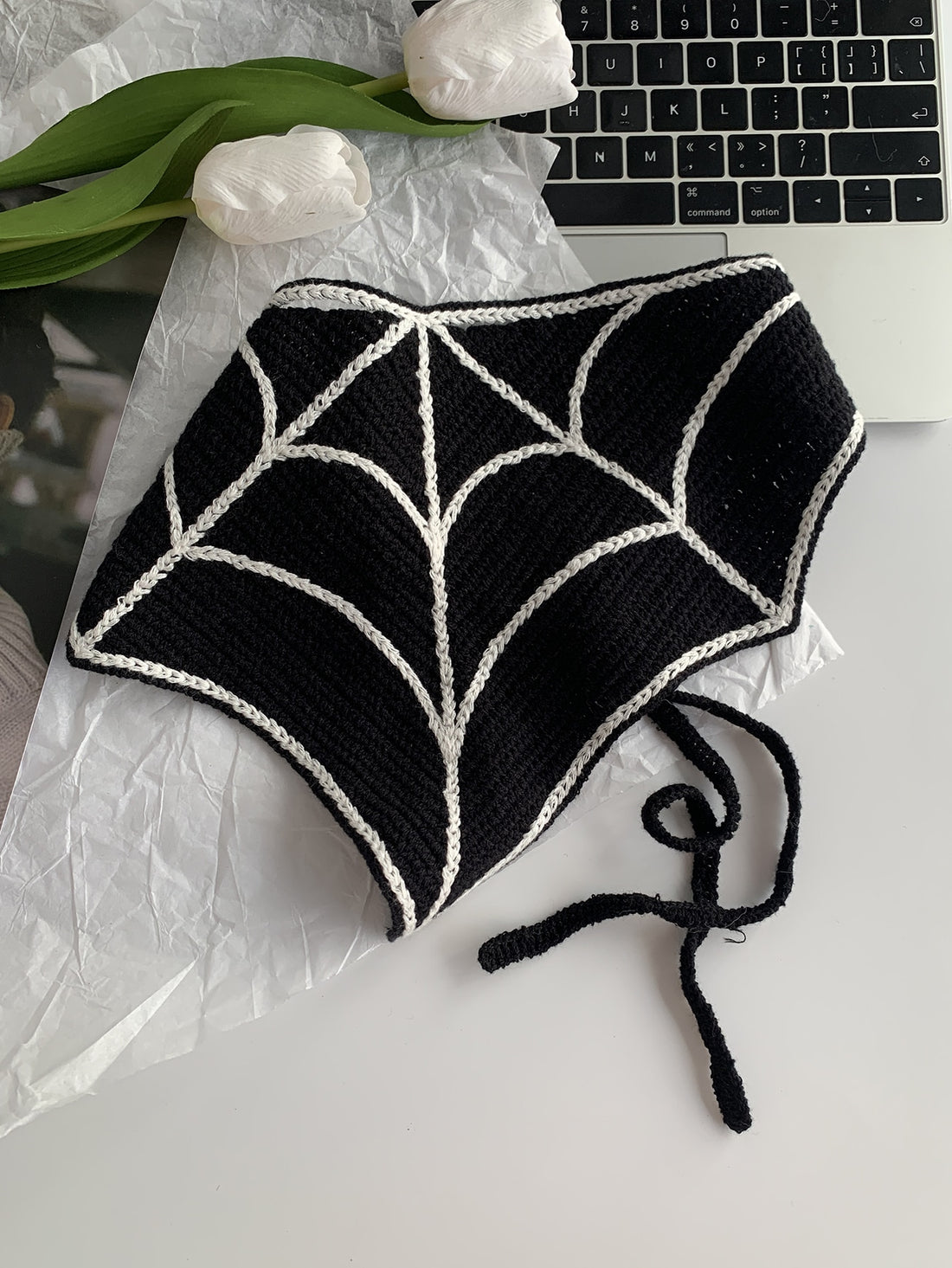 Introducing our Hand-Knit Spider Web Scarf, the perfect accessory for girl's photoshoots. This fashionable headband is hand-knit, adding a personalized touch to any outfit. Show off your style with this unique and trendy scarf.