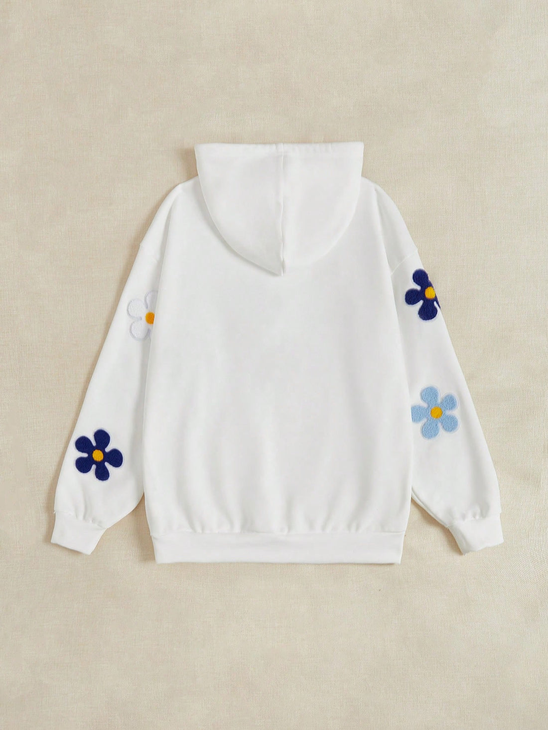 This Cozy Floral Patched Hoodie with Kangaroo Pocket offers both style and comfort for your everyday wardrobe. Made with a soft, cozy fabric, this hoodie features a unique floral design patch on the front and a convenient kangaroo pocket. Perfect for adding a touch of effortless style to any outfit.