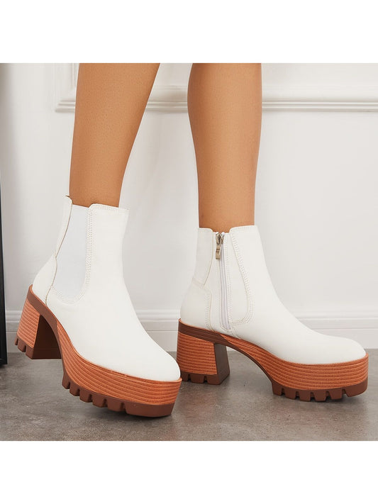 Update your wardrobe with our Chunky Heeled Chelsea Ankle Boots. These versatile booties feature a chunky heel for added stability and comfort, perfect for all-day wear. The Chelsea style adds a touch of sophistication while the lug sole provides style and traction. Elevate your style with these must-have booties.