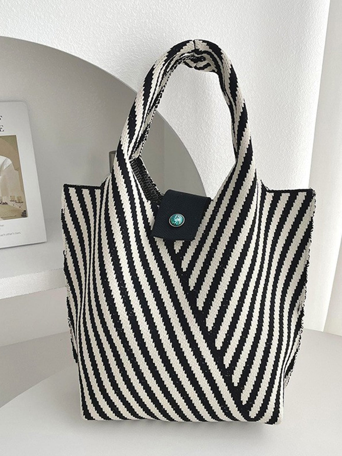 Introducing our Versatile Striped Crochet Tote Bag, the perfect companion for your everyday activities! Featuring a stylish design and sturdy construction, this bag is both fashionable and functional. With its spacious interior and durable straps, you can confidently carry all your essentials wherever you go. Upgrade your daily routine with this must-have bag!