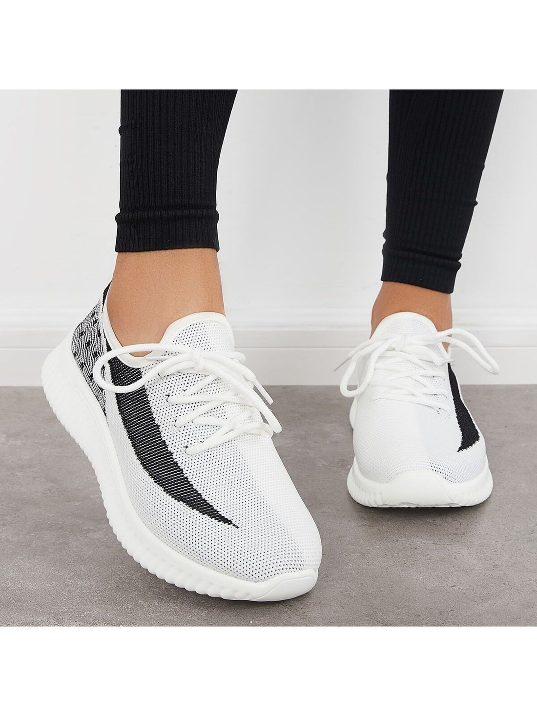 Stay comfortable and stylish during your workouts with our Lightweight Lace-Up Sneakers. These sneakers are designed with your needs in mind, providing lightweight support and a secure lace-up closure. Don't sacrifice fashion for function, our sneakers have it all.