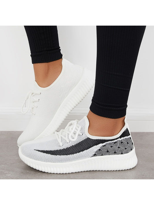 Stay comfortable and stylish during your workouts with our Lightweight Lace-Up Sneakers. These sneakers are designed with your needs in mind, providing lightweight support and a secure lace-up closure. Don't sacrifice fashion for function, our sneakers have it all.