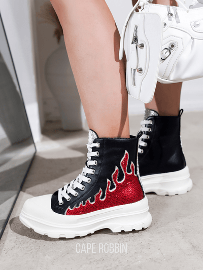 Upgrade your sneaker game with our Rhinestone Flame High Top Lug <a href="https://canaryhouze.com/collections/women-canvas-shoes?sort_by=created-descending" target="_blank" rel="noopener">Sneakers</a>! With dazzling rhinestone flames and a sturdy lug sole, these sneakers combine style and practicality. Stand out from the crowd and add a touch of sparkle to any outfit. Elevate your look today!