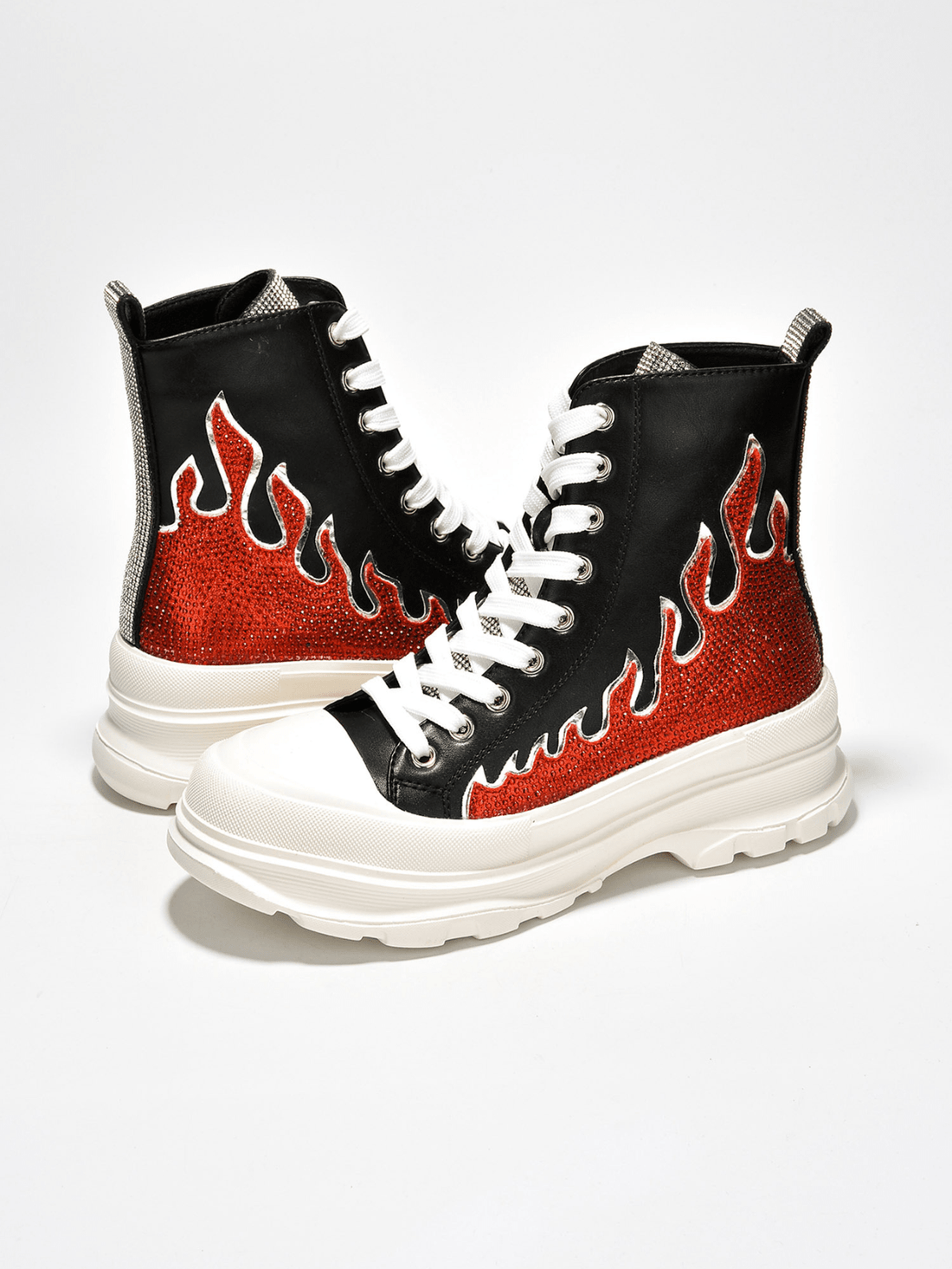 Upgrade your sneaker game with our Rhinestone Flame High Top Lug <a href="https://canaryhouze.com/collections/women-canvas-shoes?sort_by=created-descending" target="_blank" rel="noopener">Sneakers</a>! With dazzling rhinestone flames and a sturdy lug sole, these sneakers combine style and practicality. Stand out from the crowd and add a touch of sparkle to any outfit. Elevate your look today!