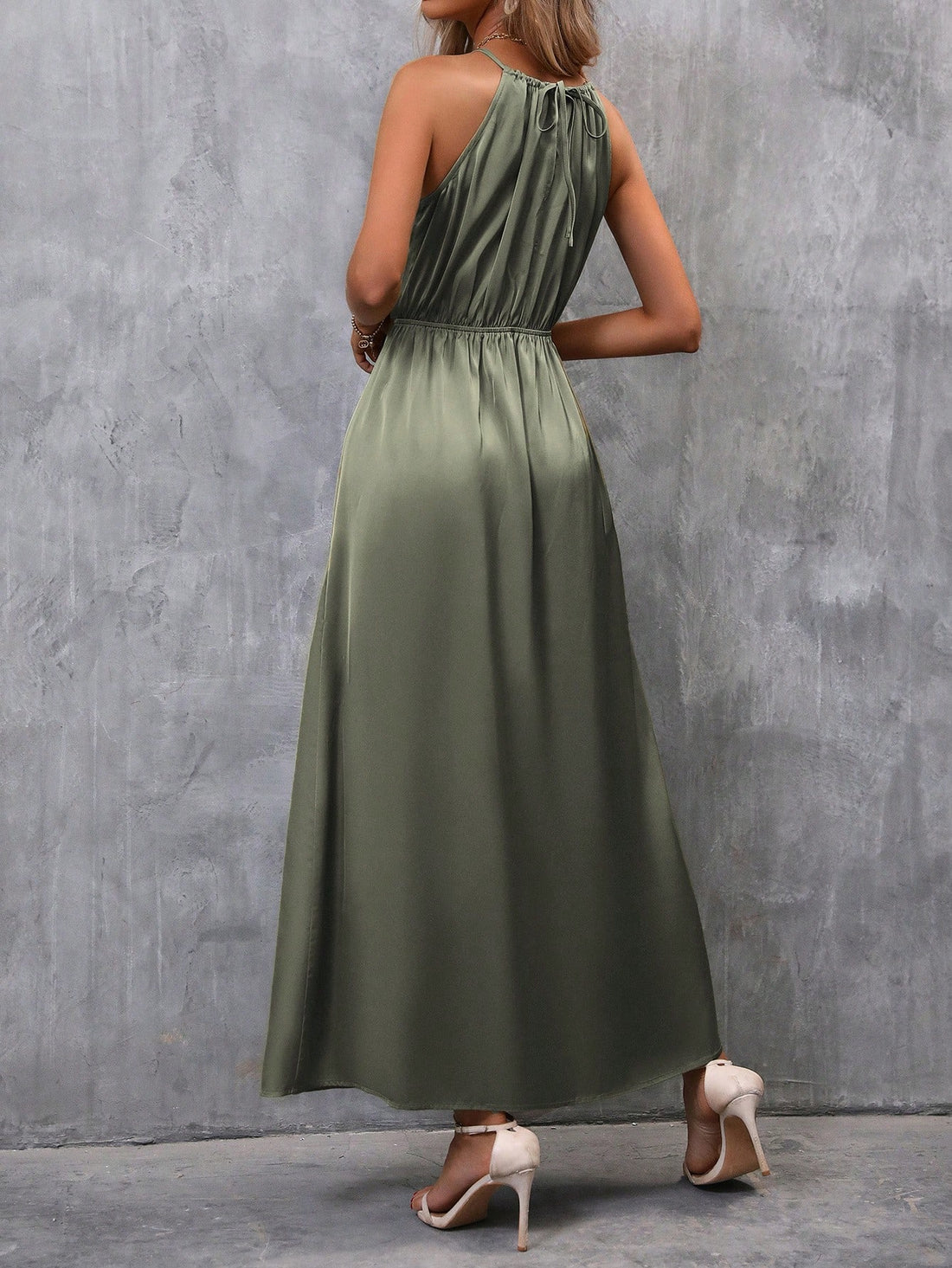 Discover chic and elegance with our Clasi Solid Split Hem Belted Halter Dress. Its split hem and belted design add a touch of sophistication to your style. Perfect for any occasion, this dress is a must-have for any fashion-forward wardrobe.