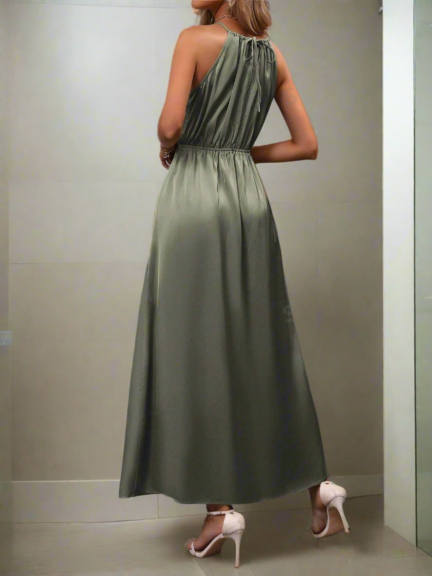 Effortlessly exude timeless elegance with our Classic Elegance: Solid Split Hem Belted Halter Dress. Featuring a halter neckline, belted waist, and split hem, this dress is perfect for any occasion. Made with high-quality materials, it combines style and comfort for a perfect fit.