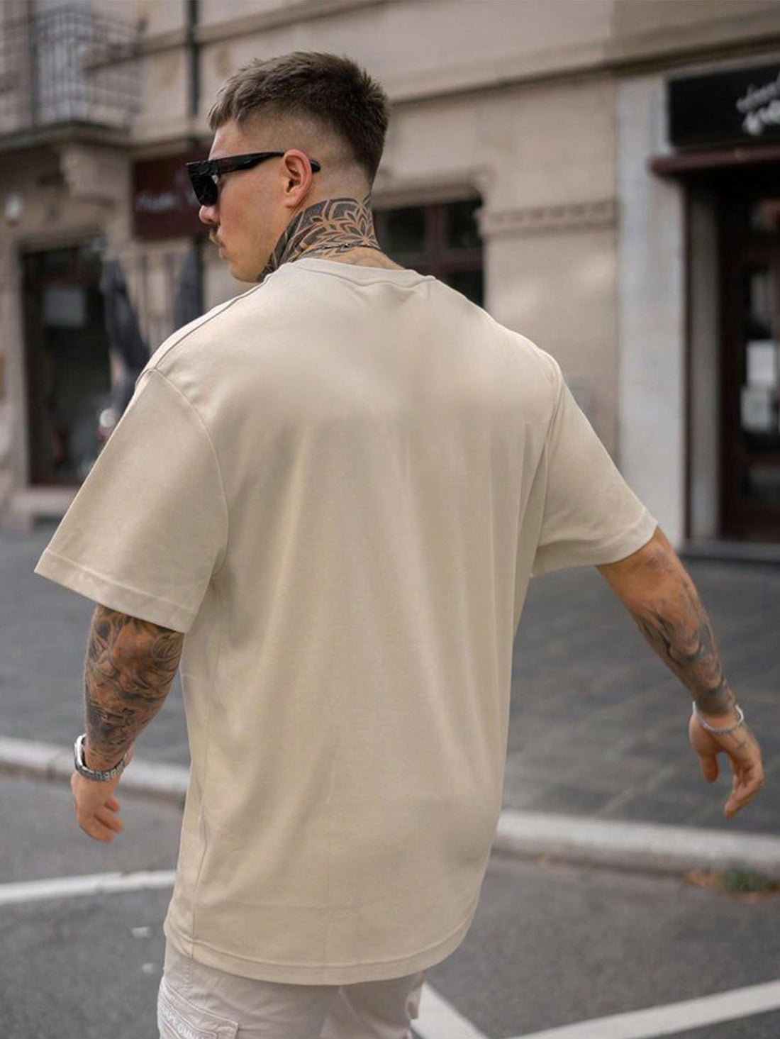 Elevate your style with our Men's Bold and Graphic Slogan Print Drop Shoulder Tshirt. Featuring a unique drop shoulder design and eye-catching slogan print, this shirt is perfect for making a statement. Made with high-quality materials, it offers both comfort and style. Upgrade your wardrobe with this must-have piece.