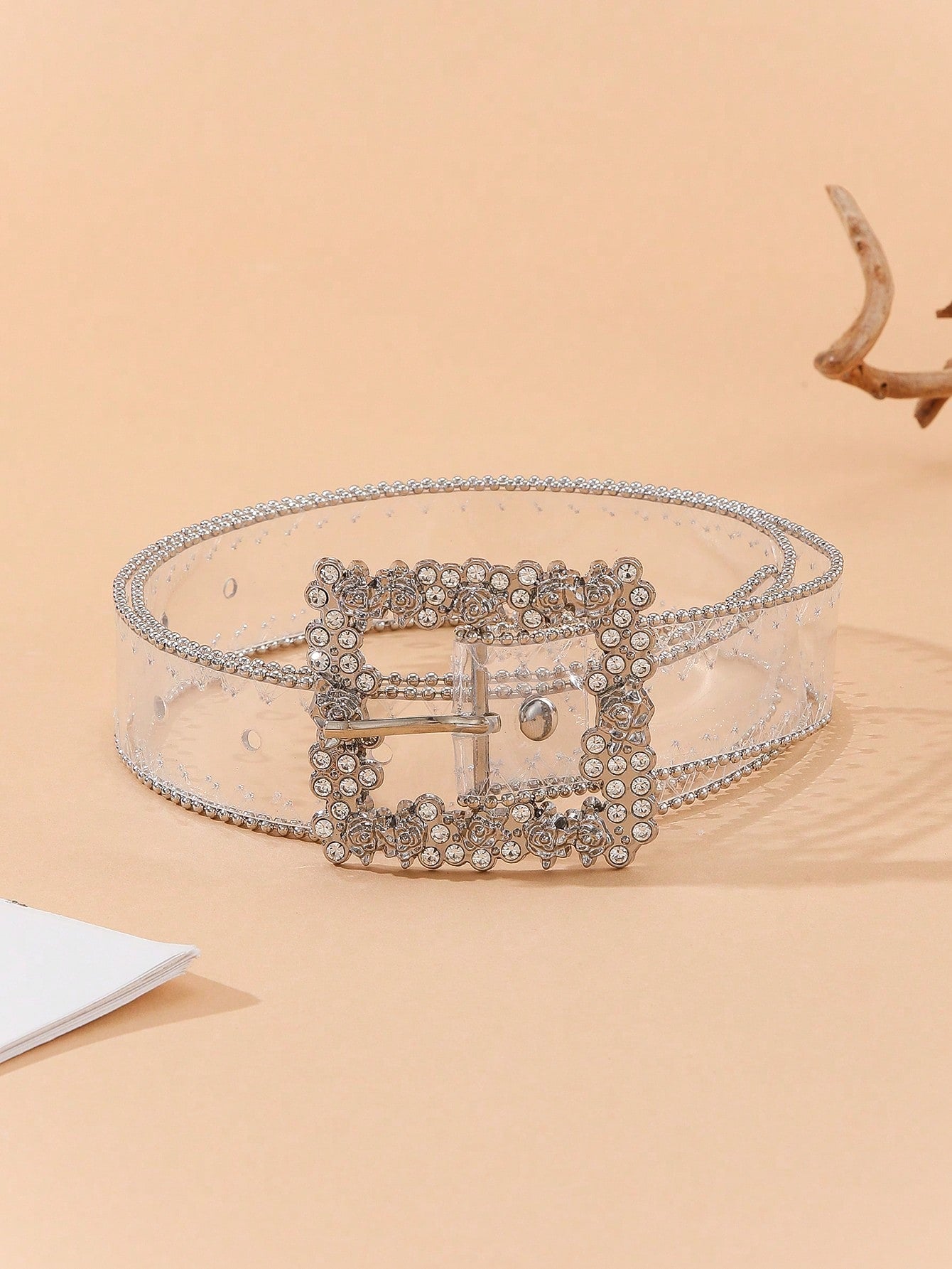 Elevate your style with our Glamourous Floral Buckle Rhinestone Belt. Featuring a stunning floral buckle with a beaded edge, this belt adds a touch of elegance to any outfit. And with the included puncher, you can achieve the perfect fit every time. Upgrade your accessory game now.