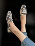 Cream PU leather loafer worn with sheer pants in indoor lifestyle shot