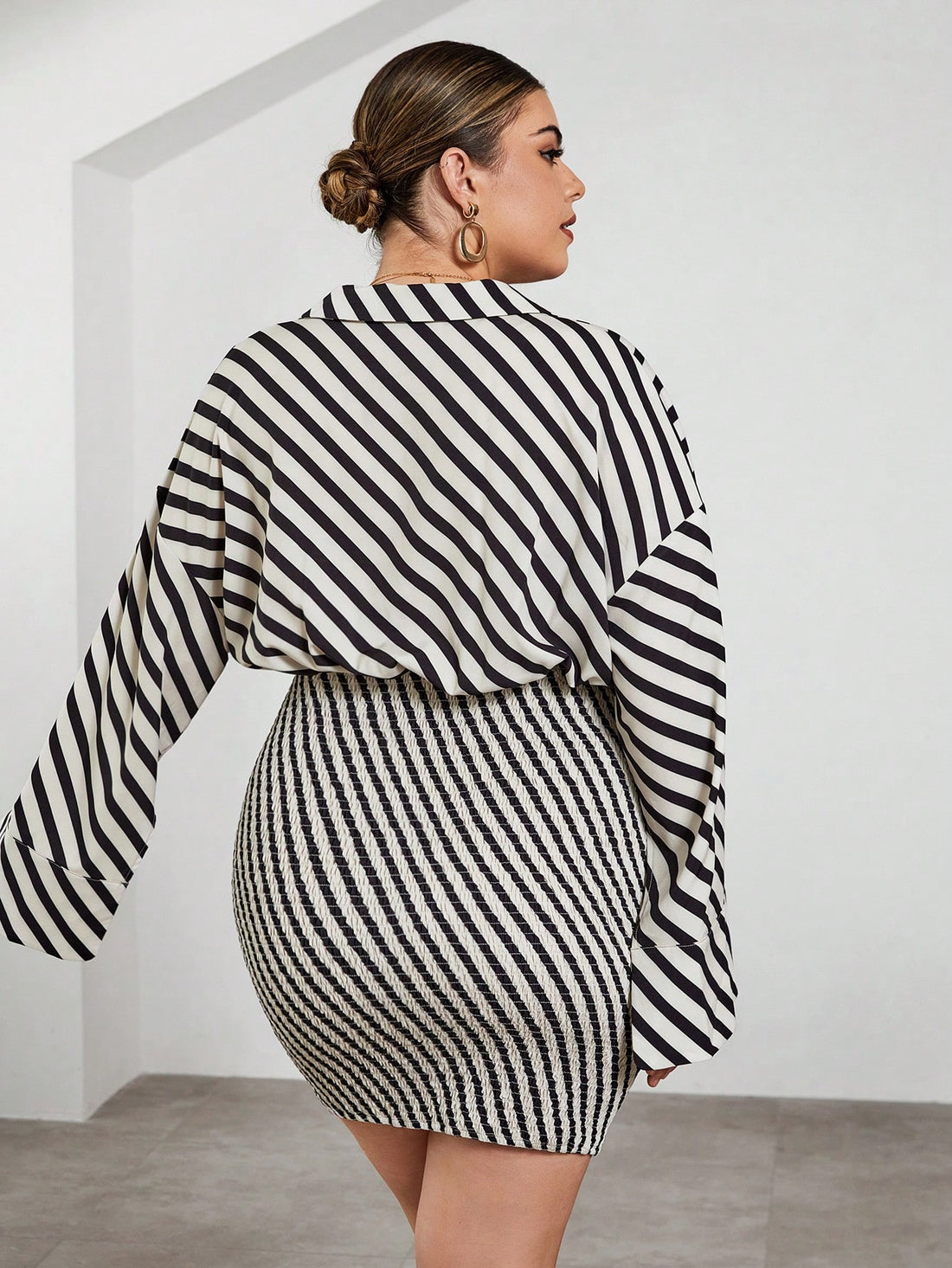 Turn heads in this Chic Plus Size Striped Bodycon Dress, where playful stripes meet flattering curves. Featuring relaxed drop shoulders and stylish split cuffs, it blends comfort with a hint of sass. Perfect for days when you want to feel confident, fun, and effortlessly chic all at once.