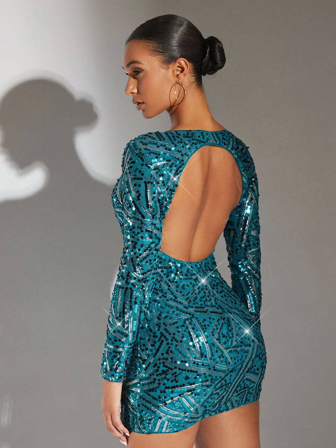 Dazzle at any party with our Gorgeous Sparkly Backless Dress. The perfect choice for your party outfits, this dress is designed to flatter your figure and make you stand out. With its striking sparkles and elegant backless design, you're sure to turn heads. Make a statement and feel confident in our stunning dress.