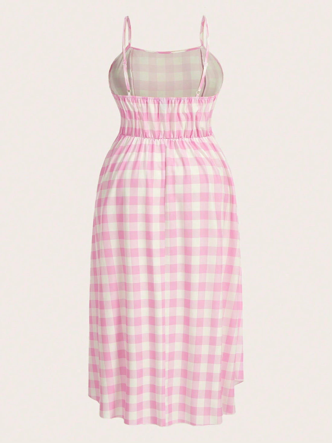 Introducing the must-have for curvy figures: our Plus Gingham Print Bow Front Cami Dress! This stylish midi dress is perfect for the summer with its playful gingham print and flattering bow front design. Stay cool and chic all season long!