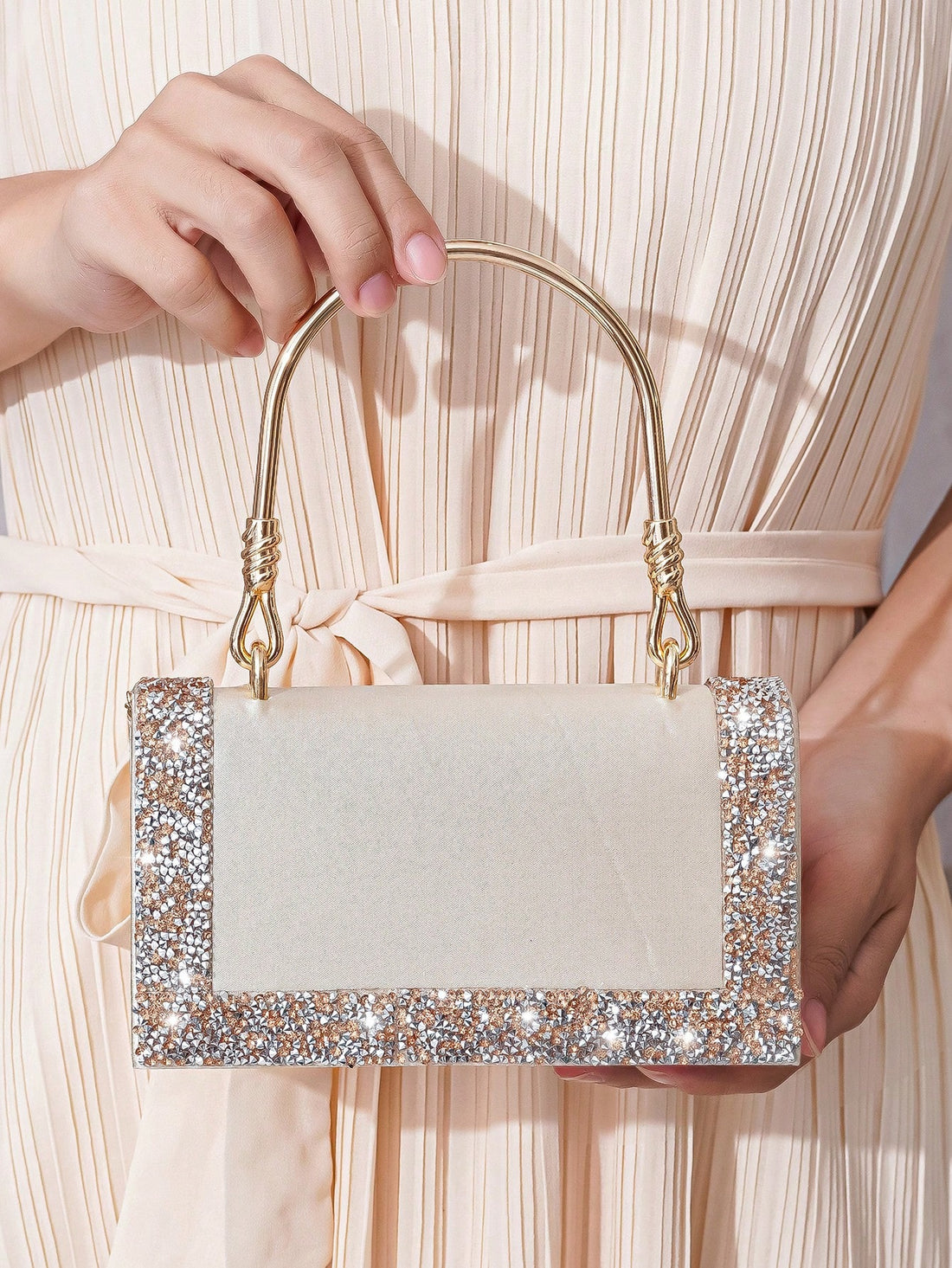 Add a glamorous touch to any party or wedding with our Elegant Rhinestone Clutch Bag. This stunning bag is designed with shimmering rhinestones and is perfect for any event. Elevate your style with this must-have accessory that will make you stand out from the crowd.