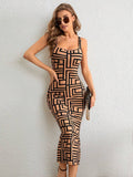 Front view of tan and black geometric tank midi dress with heels