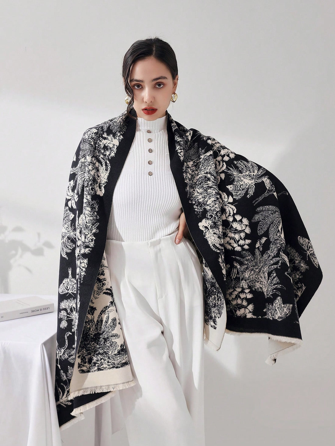 Stay stylish and comfortable with our Cozy Black Floral Retro Tasseled Blanket Scarf. Made for everyday use, this scarf will keep you warm and add a touch of retro elegance to your outfit. With its floral design and tasseled edges, this scarf is the perfect accessory for any occasion.