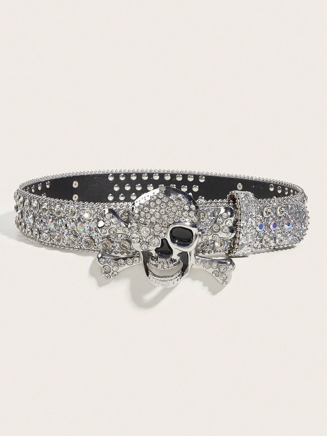 Upgrade your style with our Skull Head Rhinestone Rivet Belt Buckle! This bold accessory is perfect for adding edge to any outfit. The intricate skull design and sparkling rhinestones make a statement that sets you apart. Show off your unique, fearless style with our buckle.