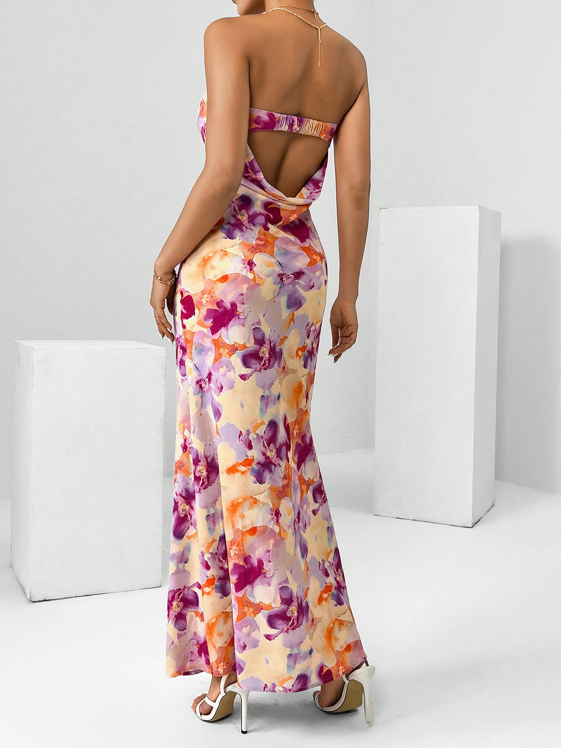 Get ready to bloom this Spring Break with our Chic Floral Draped Backless Tube Dress! This flowy and flirty dress is the perfect addition to your vacation wardrobe. Its unique draped back design adds a touch of playfulness, making it perfect for any sunny adventure. (Limited quantities available!)