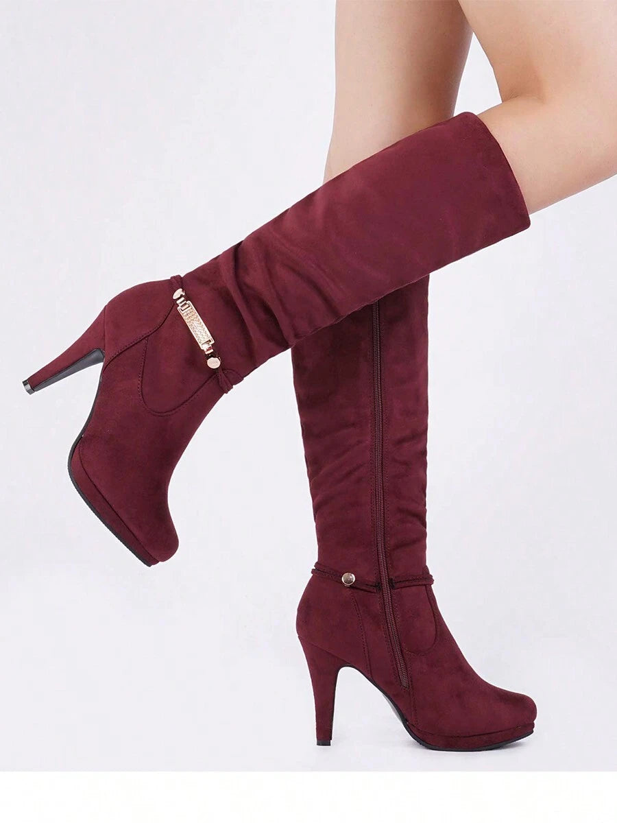 Step into autumn with serious style in these knee-high platform heel boots! Designed to elevate your fall wardrobe (literally), these beauties feature a sleek silhouette that pairs perfectly with everything from cozy sweaters to chic dresses. The sturdy platform sole keeps you comfortable while the statement heel adds that extra dose of confidence to your stride. Whether you're heading to brunch or a night out, these boots are your new go-to for turning heads and owning every season.