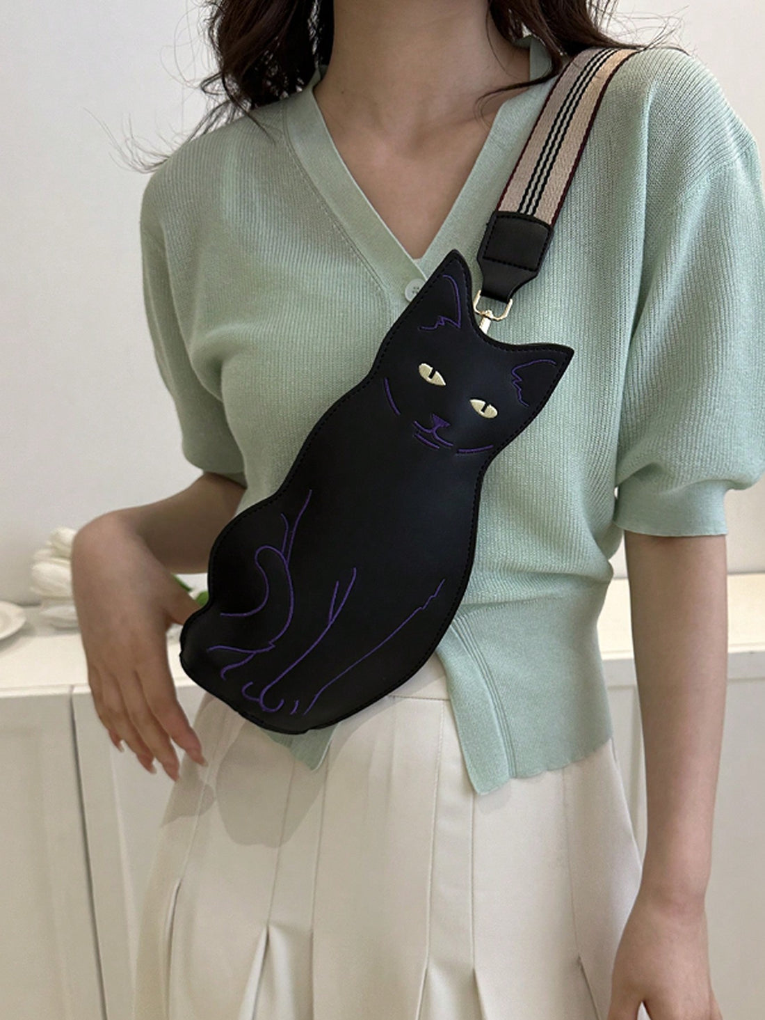 The Charming Cat-Shaped PU Crossbody Bag is the perfect accessory for cat lovers. Made from waterproof PU material, it is both stylish and practical. With its cat-shaped design, it adds a playful touch to any outfit. Stay organized and trendy with this must-have fashion item.