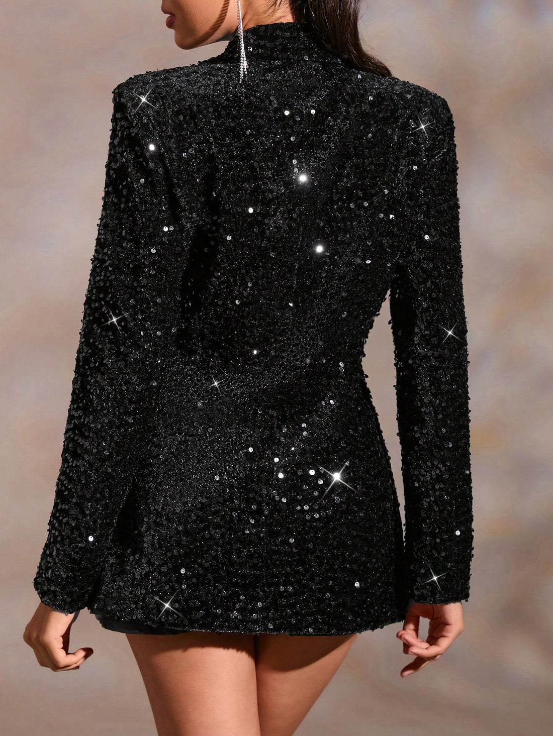 Elevate your style game with the Sparkle & Chic: Sequin Blazer Dress. The dazzling sequin design, paired with a classic lapel neck, brings sophistication and glamour to any occasion. Stand out and shine in this must-have statement piece.