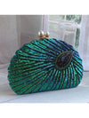 Elegant and eye-catching, our Shimmering Peacock Feathers clutch wallet adds a touch of glamour to any occasion. Adorned with glittering sequins, this wallet is perfect for parties, weddings, and proms. Its shimmering design is sure to catch everyone's attention, making you stand out in style.