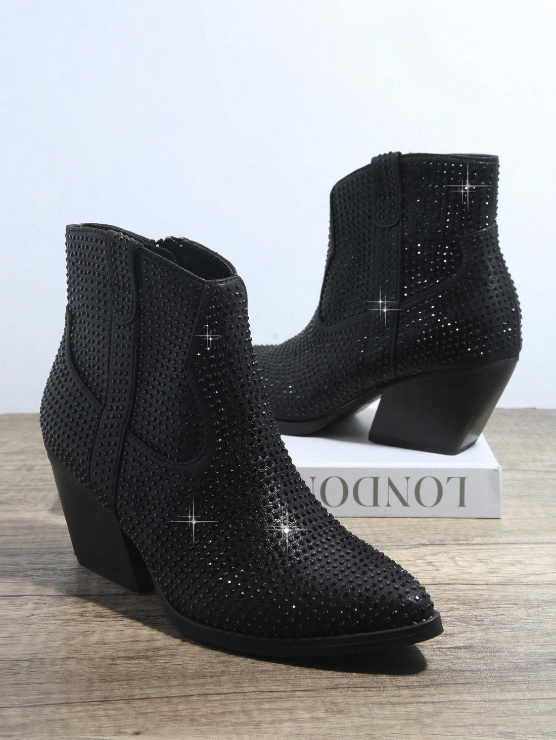 Elevate your style with these Sparkling Rhinestone Zipper Booties. Designed with a zipper for easy wear and adorned with sparkling rhinestones, these booties will add a touch of glamour to any outfit. Walk with confidence and shine with every step in these stunning booties.