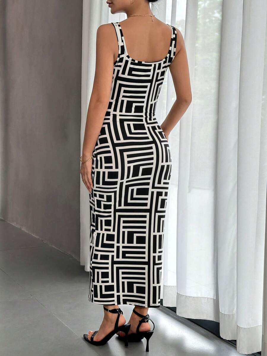 Back view of black and white square-neck geometric midi dress