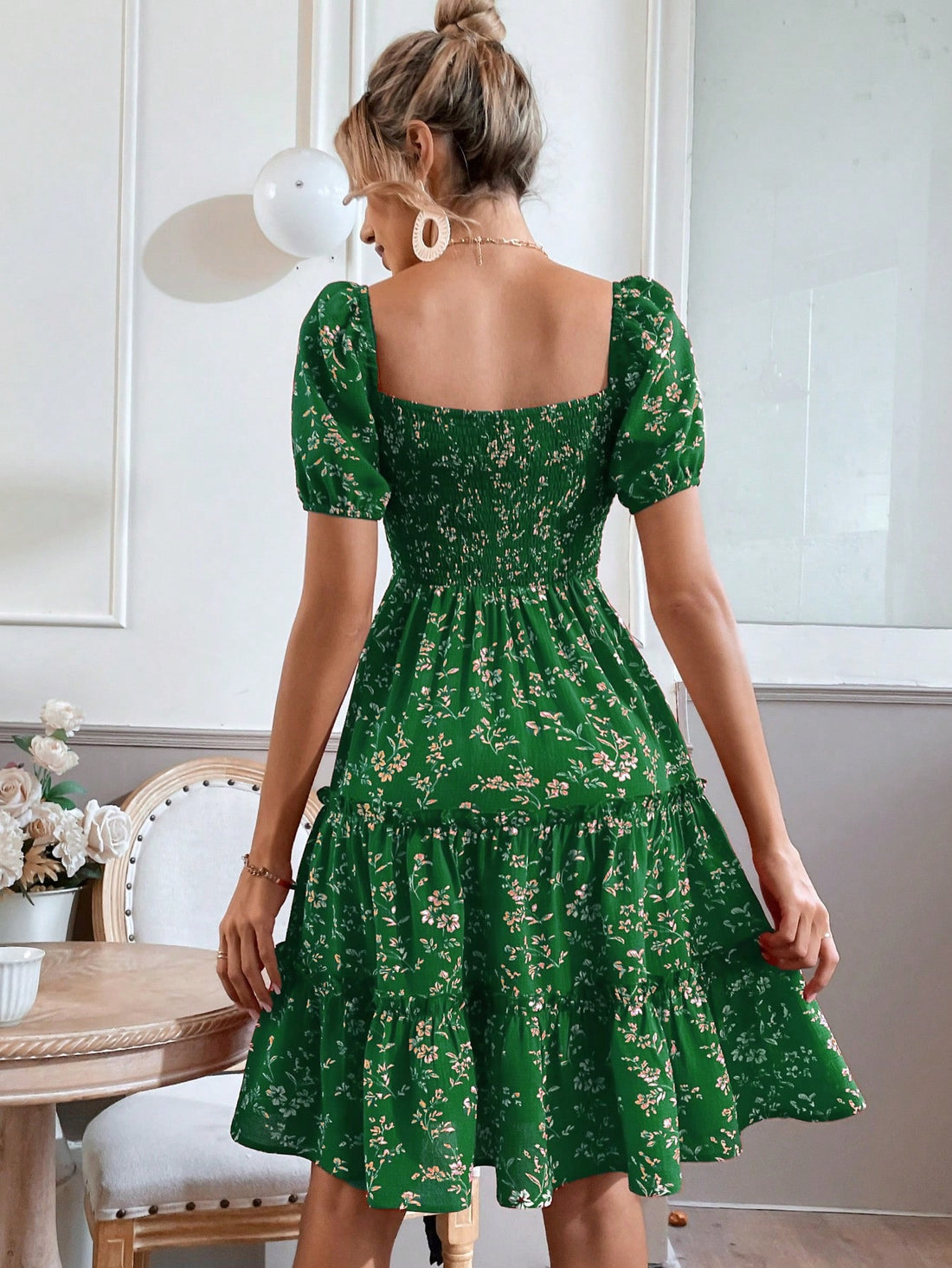 Unleash the enchantment of unity in this floral puff sleeve dress. With a shirred layered hem, this dress combines whimsy and elegance in perfect harmony. Embrace the magic of this dress and watch as you become one with it (and your style game)!