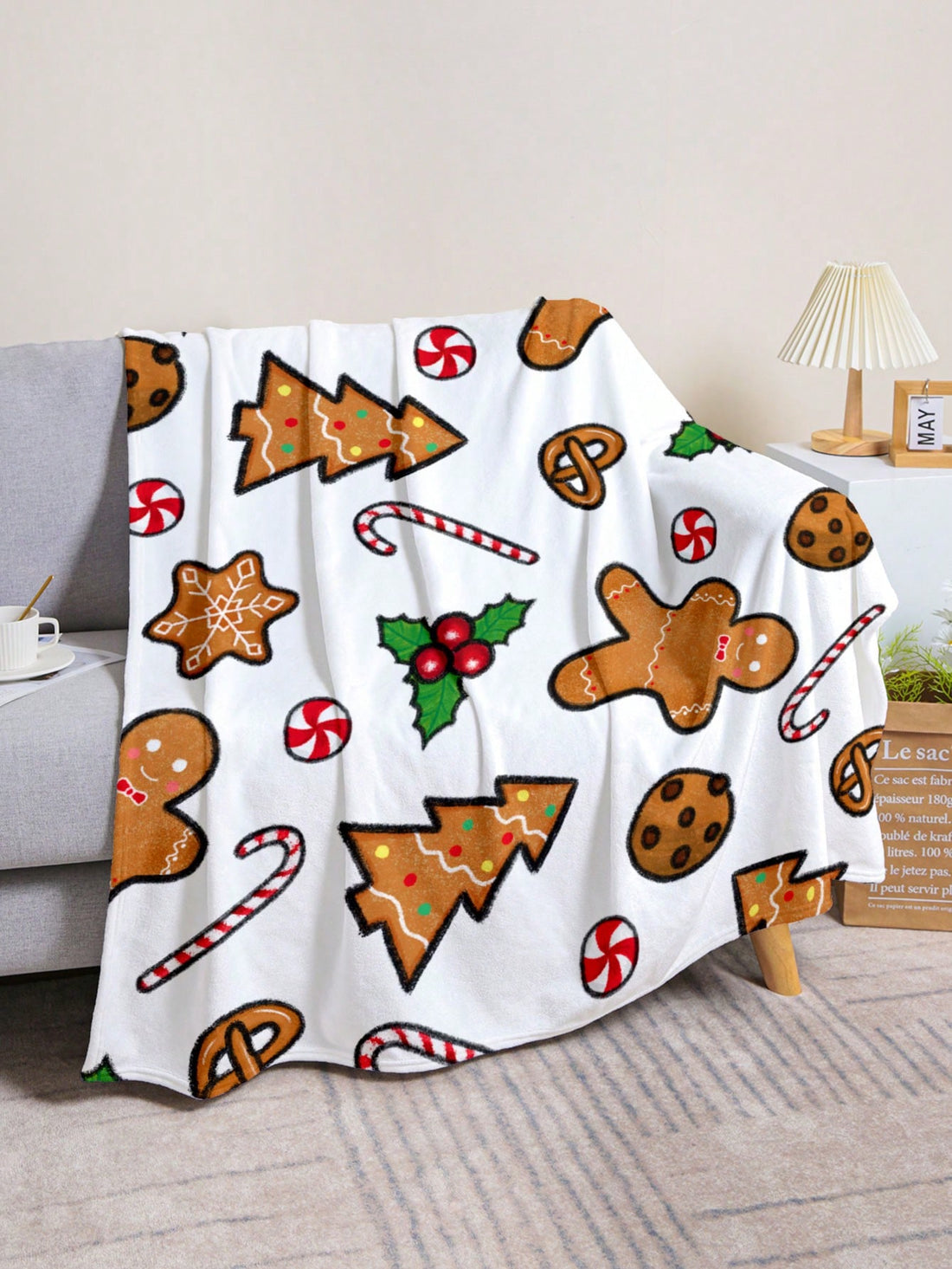 Get in the festive spirit with our Cozy Candy Gingerbread Man Blanket! Perfect for adding a touch of fun to your home decor, this blanket features a charming gingerbread man design. Made with soft, cozy material, it's the perfect blanket to snuggle up with during the holiday season.