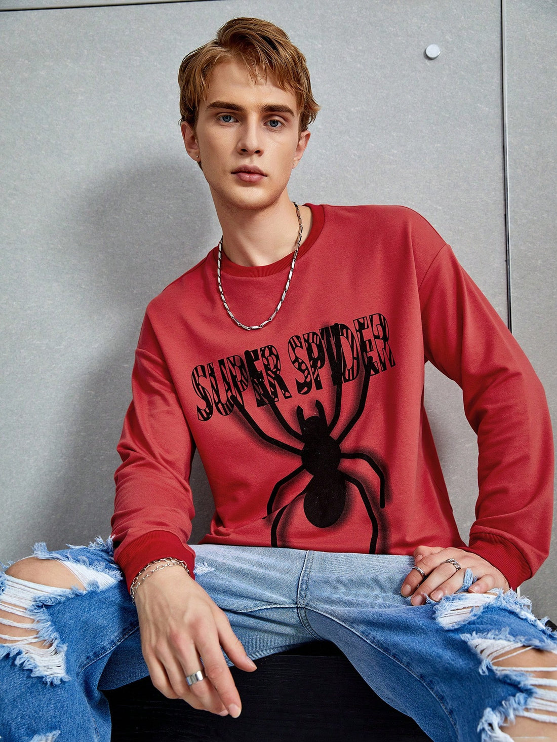 Stay stylish and comfortable with our Men's Spider Print Drop Shoulder Pullover. Featuring a unique spider print and a slogan design, this pullover is perfect for adding a touch of personality to your wardrobe. The drop shoulder design also offers a relaxed and comfortable fit. Elevate your style while staying cozy.