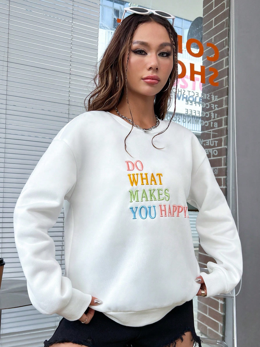 Made with a comfortable drop shoulder design, this sweatshirt features a playful reminder to do what makes you happy. Stay cozy and inspired while spreading positivity with this must-have wardrobe staple.