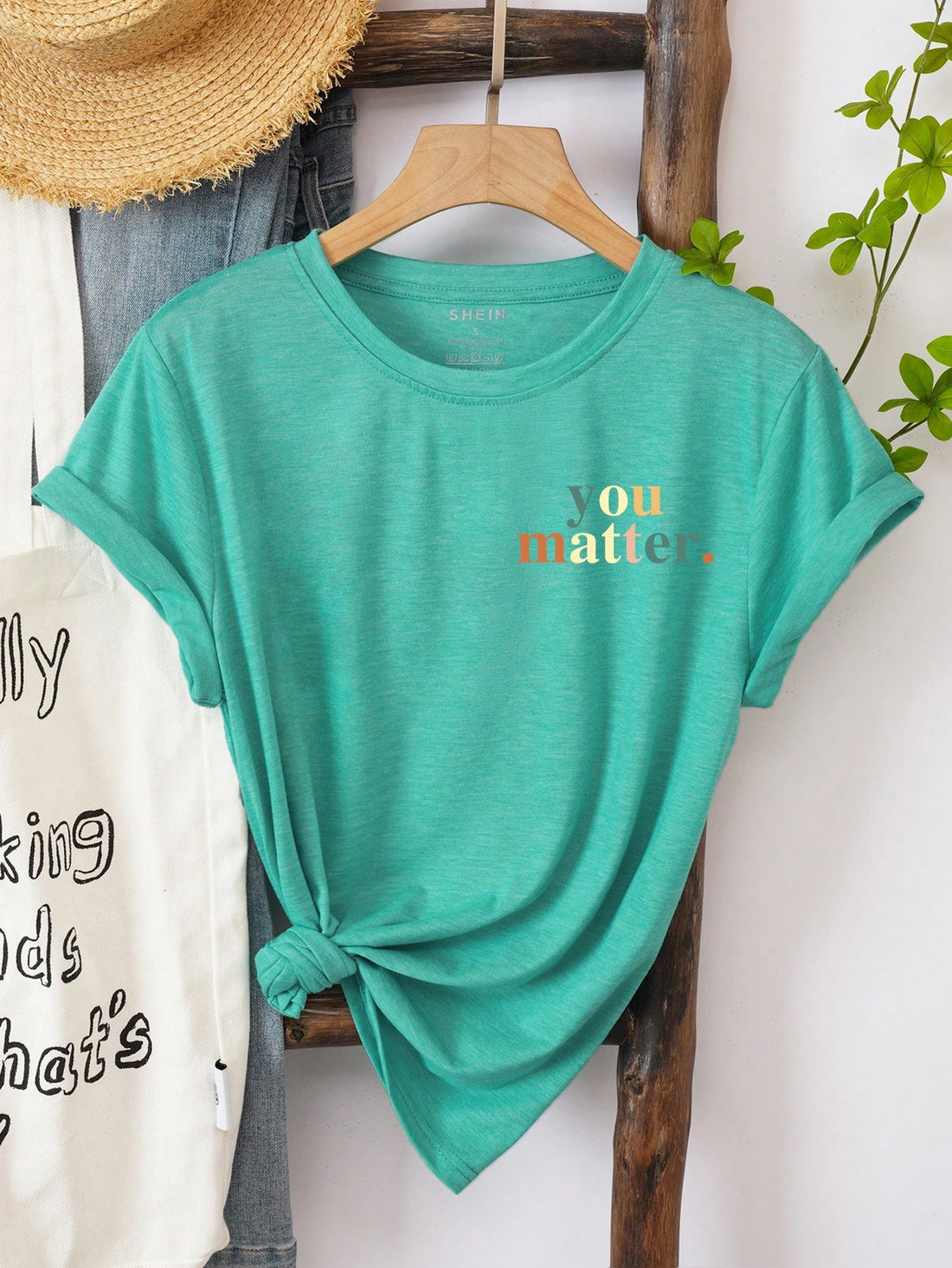 Show off your confidence with our Empowering 'To the Person Behind Me' Graphic Tee! Embrace your beauty and strength in this quirky and playful shirt. Let those behind you know they're following someone fierce. (Cliché-free and under 50 words!)