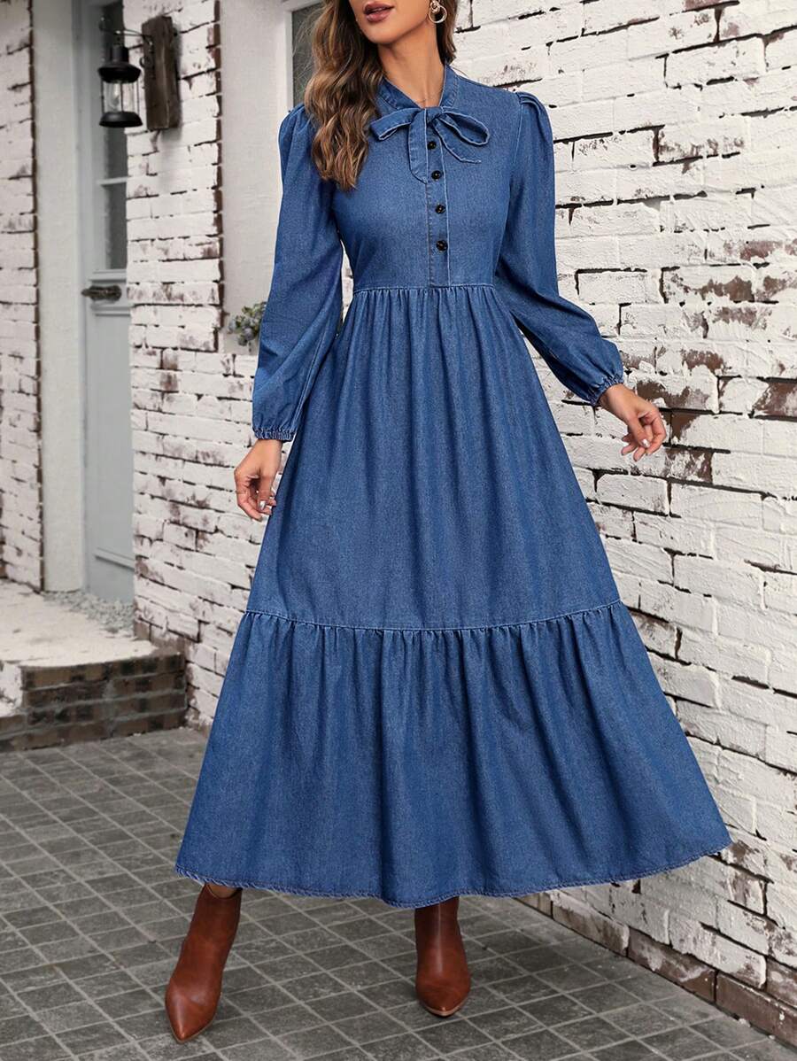 Front view of denim tie neck maxi dress with lantern sleeves and tiered hem