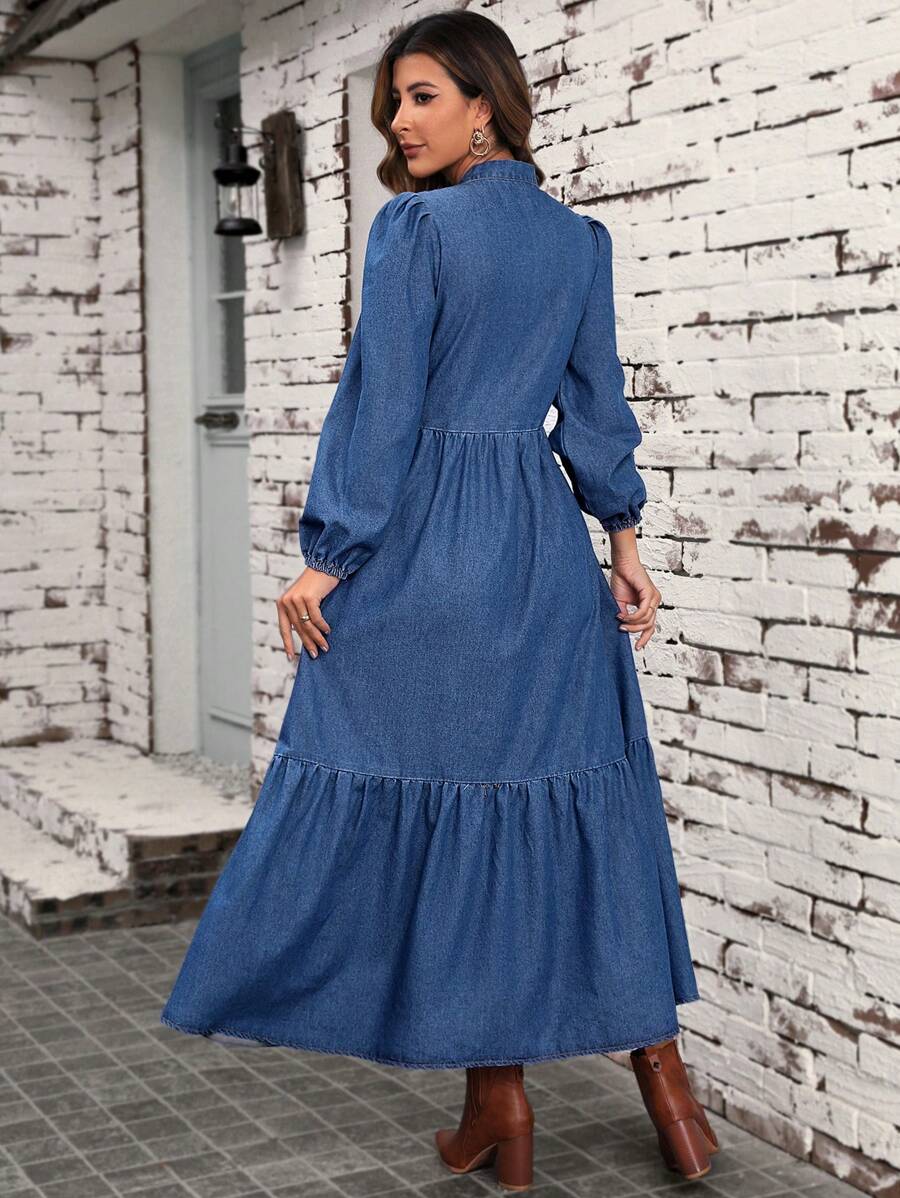 Front view of denim tie neck maxi dress with lantern sleeves and tiered hem