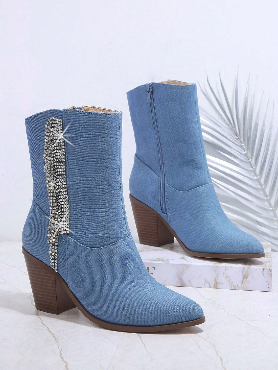 Elevate your fashion game with our Glamorous Rhinestone Side Zipper Boots. Featuring stunning rhinestone embellishments and a convenient side zipper, these boots are the perfect addition to your wardrobe. Show off your style and step out with confidence.