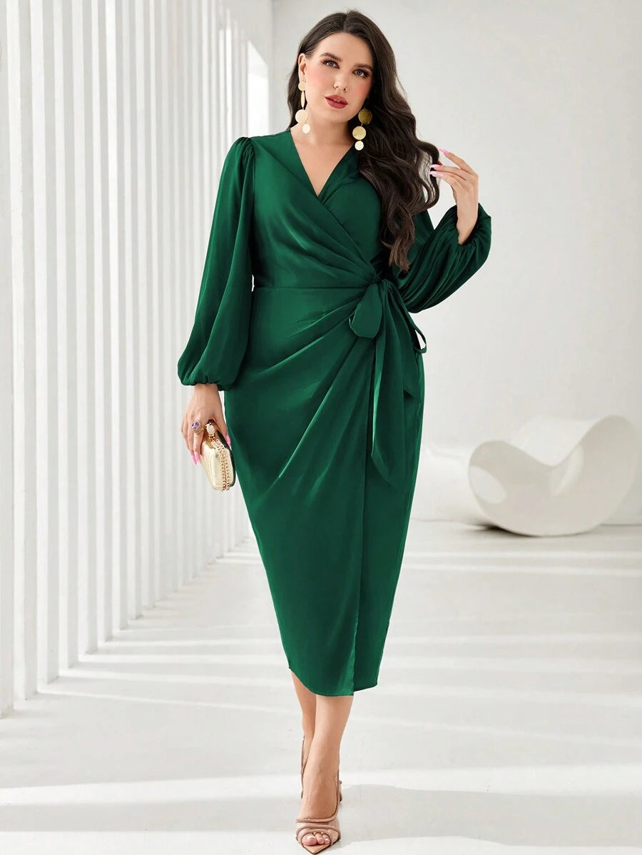 Make a statement in this stunning plus-size wrap dress that's equal parts sophisticated and fun. The dramatic lantern sleeves add movement and flair, while the flattering side knot detail cinches your waist beautifully. Perfect for evening events, galas, or any occasion where you want to feel absolutely fabulous. The flowing silhouette skims your curves in all the right ways, giving you confidence and comfort. Dress it up with heels and jewelry, or keep it effortlessly chic—this gown adapts to your style an