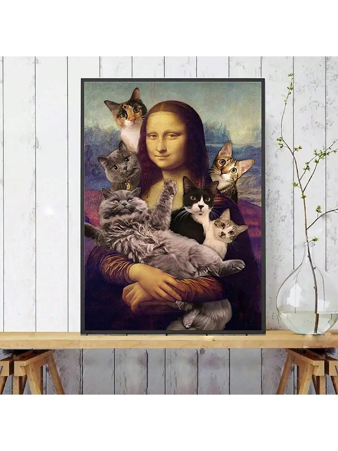 Elevate your decor with our whimsical canvas painting featuring the iconic Mona Lisa surrounded by adorable cats. Made with high-quality materials, this wall art will bring a playful touch to any room. Add a touch of charm and sophistication to your home with this unique piece.