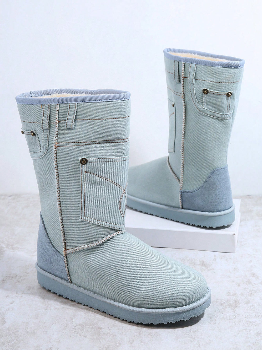 This winter, stay cozy and fashionable with Polar Patch Pocket Snow Boots. Designed to keep your feet warm and dry, these boots feature a convenient pocket for storing small essentials. With a stylish design and durable construction, these boots will be your go-to choice for facing the cold weather.