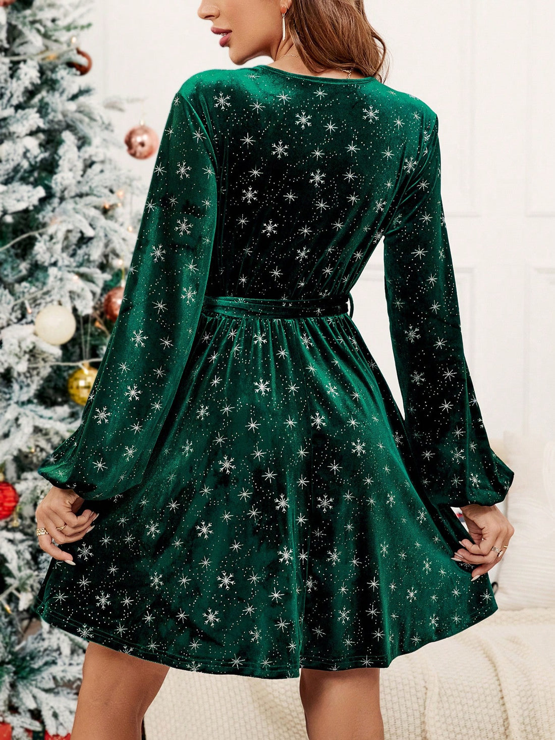 This elegant velvet dress features a unique snowflake print and statement lantern sleeves. Complete the look with the included belt for a chic and sophisticated ensemble. Stay stylish and warm this winter season.