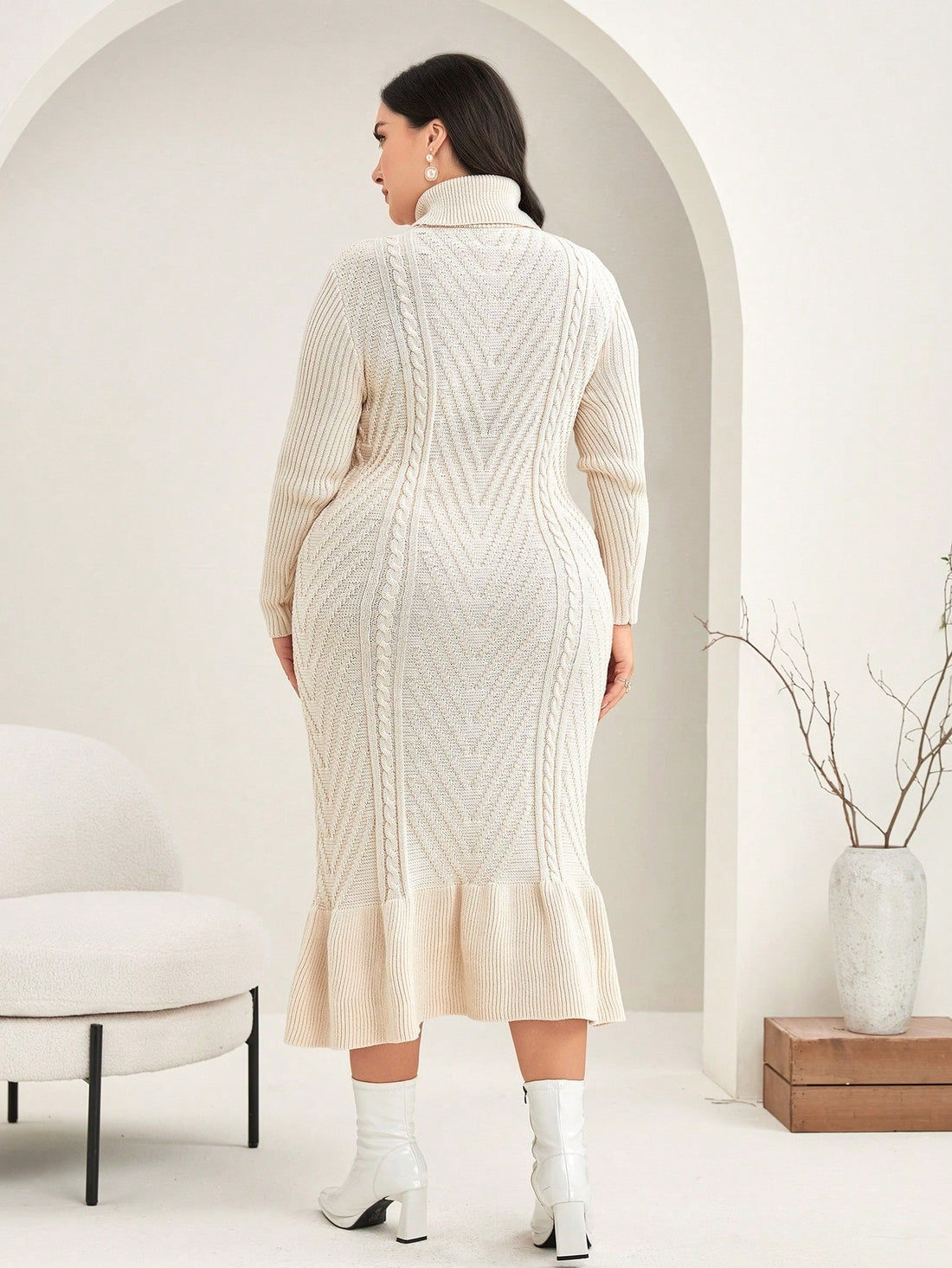 Step into cozy chic with this plus-size sweater dress featuring a high neck and playful ruffle details. Perfect for adding a touch of elegance without sacrificing comfort, it’s your go-to for effortless style that hugs your curves in all the right places. Whether you're dressing up or down, this dress makes feeling fabulous a breeze!