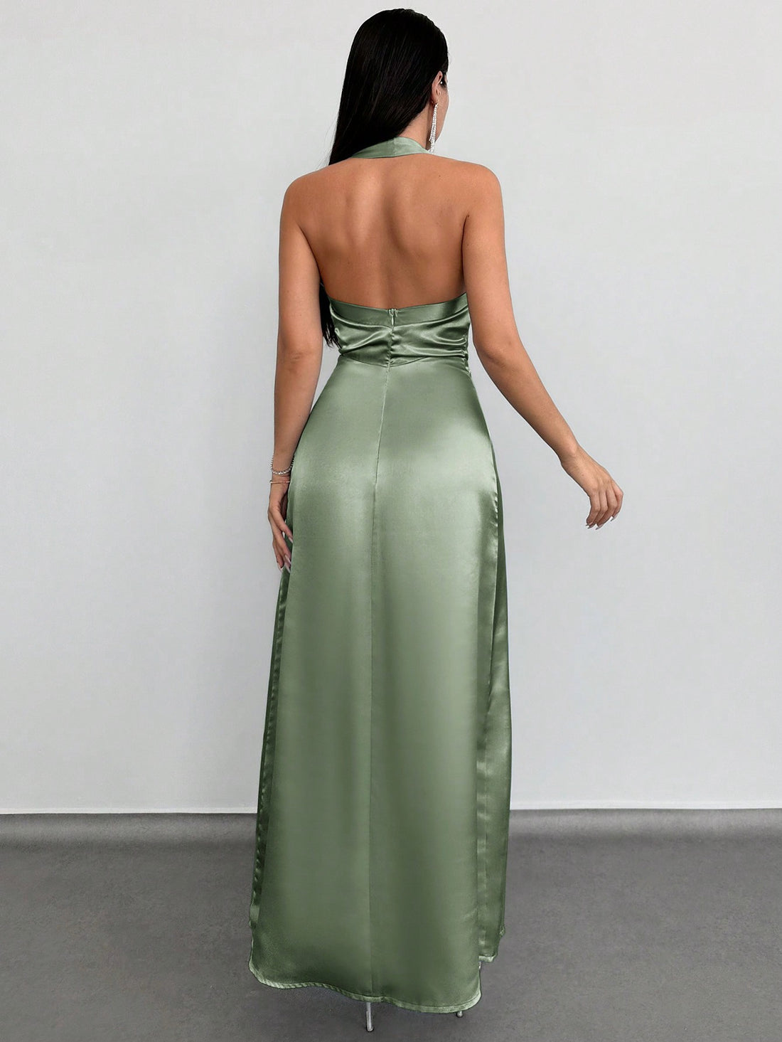 Elevate your style with our Elegant Backless Satin Maxi Dress. Designed with a stunning halter neck, this dress exudes sophistication and grace. Made with luxurious satin fabric, it drapes seamlessly and feels comfortable against the skin. Perfect for special occasions and evening events, this dress is sure to make you stand out with its elegant backless design.