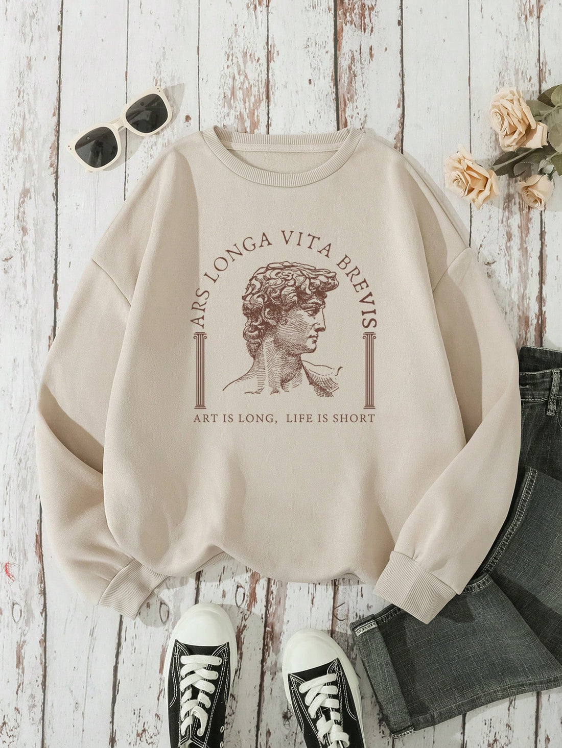 This Artful Expression pullover features a 'Life is Short' graphic and drop shoulder design for a relaxed and stylish look. Made from quality materials, it offers comfort and durability. Show off your fashion sense and express a meaningful message with this unique piece.