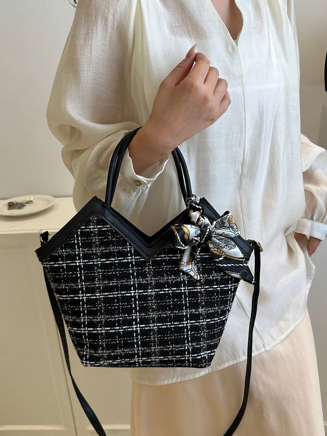 Introducing our versatile Chic Bow-Decor Mini Handbag, complete with a stylish scarf accessory. This crossbody tote is perfect for any occasion with its functional design and elegant bow detail. Make a statement while staying organized and on-trend.