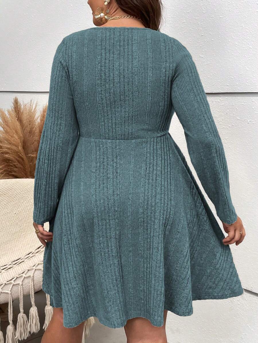 Embrace cozy charm with this Plus Size Ribbed Knit Scoop Neck A-Line Dress, perfect for fall adventures. The flattering scoop neckline and soft ribbed knit fabric offer comfort and style, while the A-line cut adds a playful twirl to your casual look. Easy to dress up or down, this dress is your new go-to for effortlessly chic, comfy days.