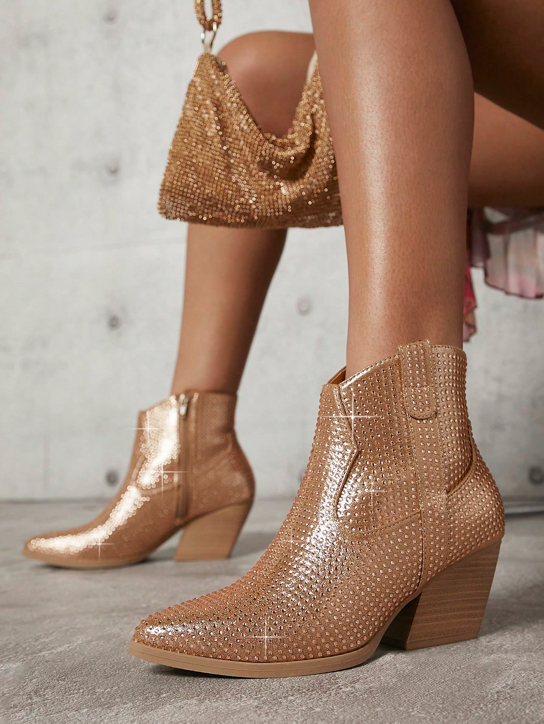 Enhance your style with these Rhinestone-Embellished Slip-On Ankle Booties. These versatile and stylish booties add a touch of effortless glam to any outfit. The rhinestone embellishments add a hint of sparkle, while the slip-on design makes them easy to wear. Elevate your look with these must-have booties.