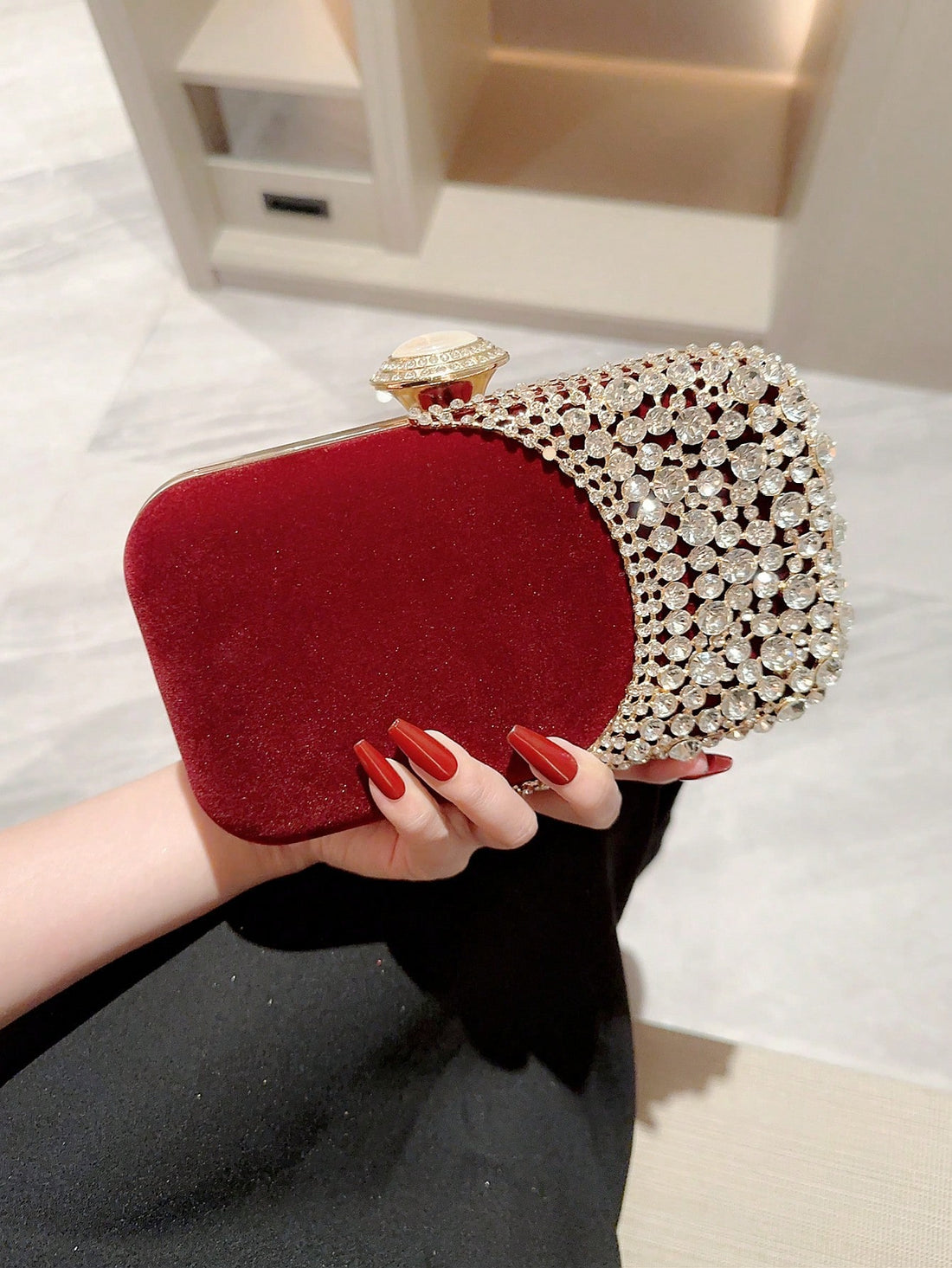 Elevate your formal attire with the Sparkling Moonlit Eve Clutch. This elegant evening bag features rhinestone embellishments, adding a touch of sparkle to your ensemble. Perfect for special occasions, this clutch exudes sophistication and style. Complete your look with this exquisite accessory.
