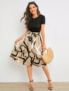 A Stylish Statement Piece with Geometric Graphic Print Belted Dress