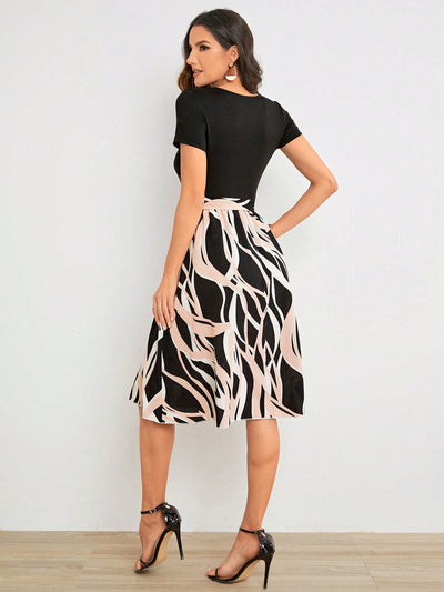 A Stylish Statement Piece with Geometric Graphic Print Belted Dress